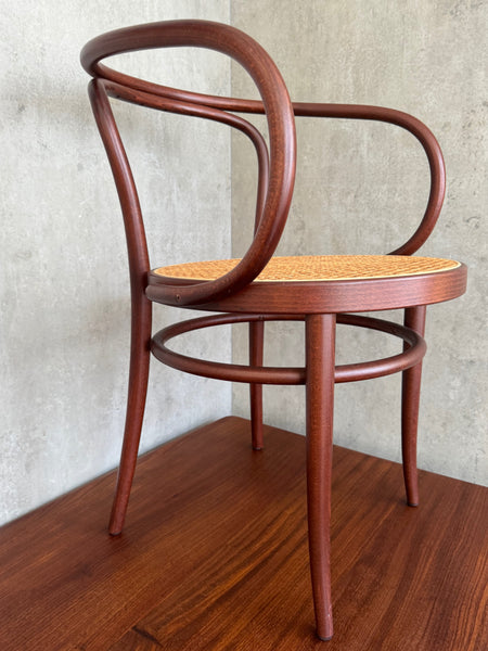 A Thonet Model 209 bentwood armchair with a cane seat (1970s)