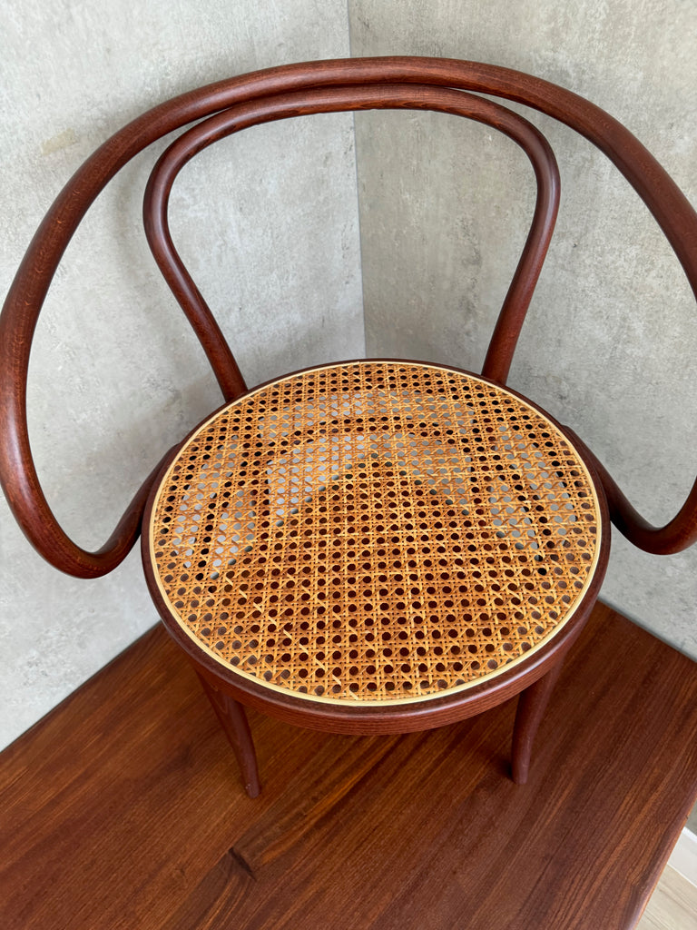 A Thonet Model 209 bentwood armchair with a cane seat (1970s)