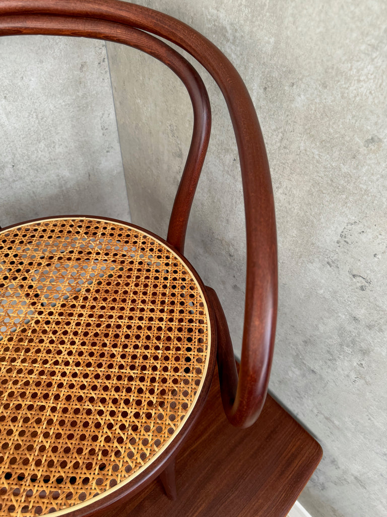 A Thonet Model 209 bentwood armchair with a cane seat (1970s)