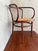 A Thonet Model 209 bentwood armchair with a cane seat (1970s)