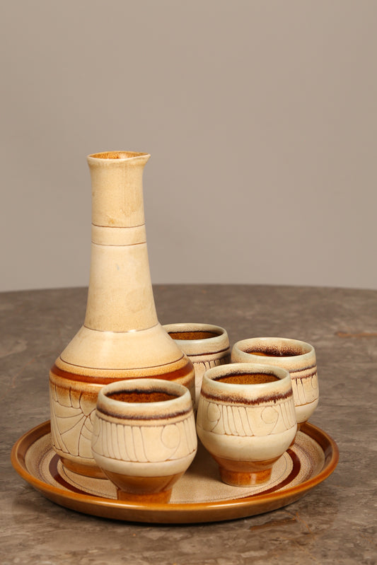 Celtic Pottery decanter with tray and 4 beakers in 'Medallion' design (1960s) Cornwall