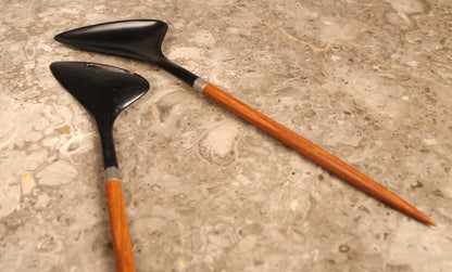 A pair of Danish salad servers in teak and black plastic designed by Helge Bezi, Denmark (1960s)