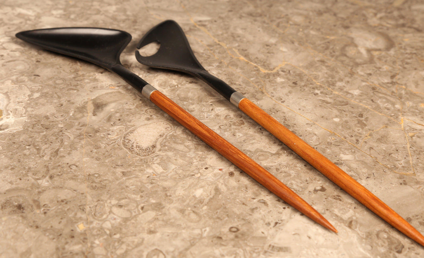 A pair of Danish salad servers in teak and black plastic designed by Helge Bezi, Denmark (1960s)