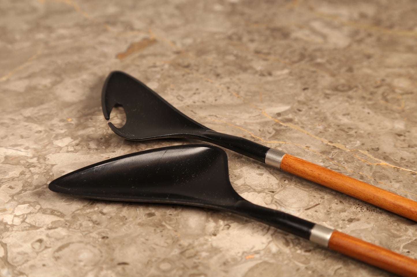 A pair of Danish salad servers in teak and black plastic designed by Helge Bezi, Denmark (1960s)