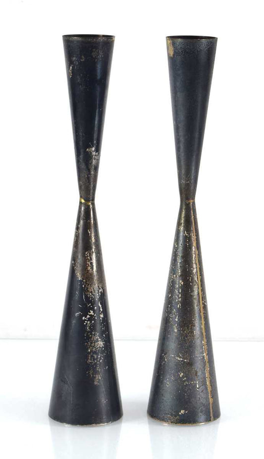 A pair of 'Jigger' form modernist metal ware candle holders by Allan Adler (USA)